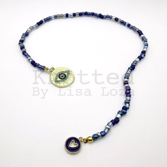 Blue beaded bookmark with clear eye and blue heart charms by Knotted by Lisa Loza