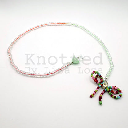 Colorful string beaded bookmark with bow and mushroom charms