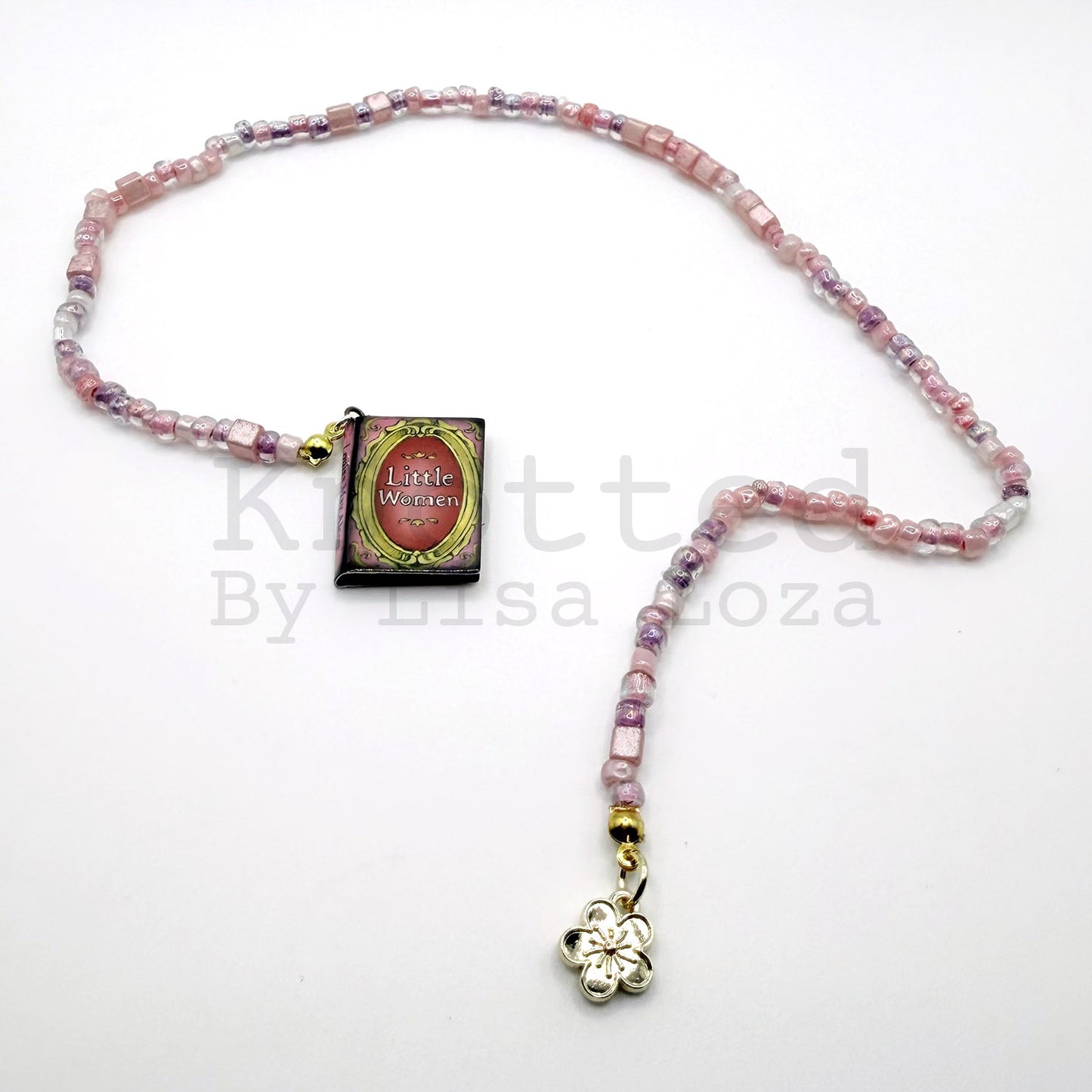 Pink beaded bookmark with Little Women book and flower charms