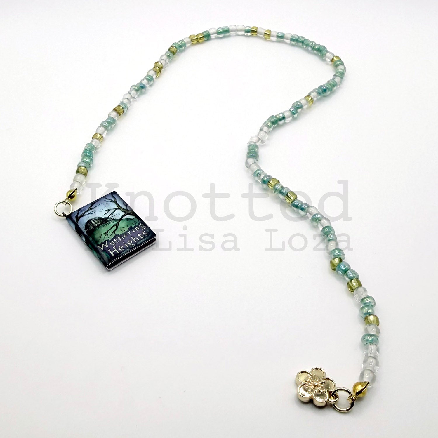 Teal and gold beaded bookmark with Wuthering Heights book and flower charms