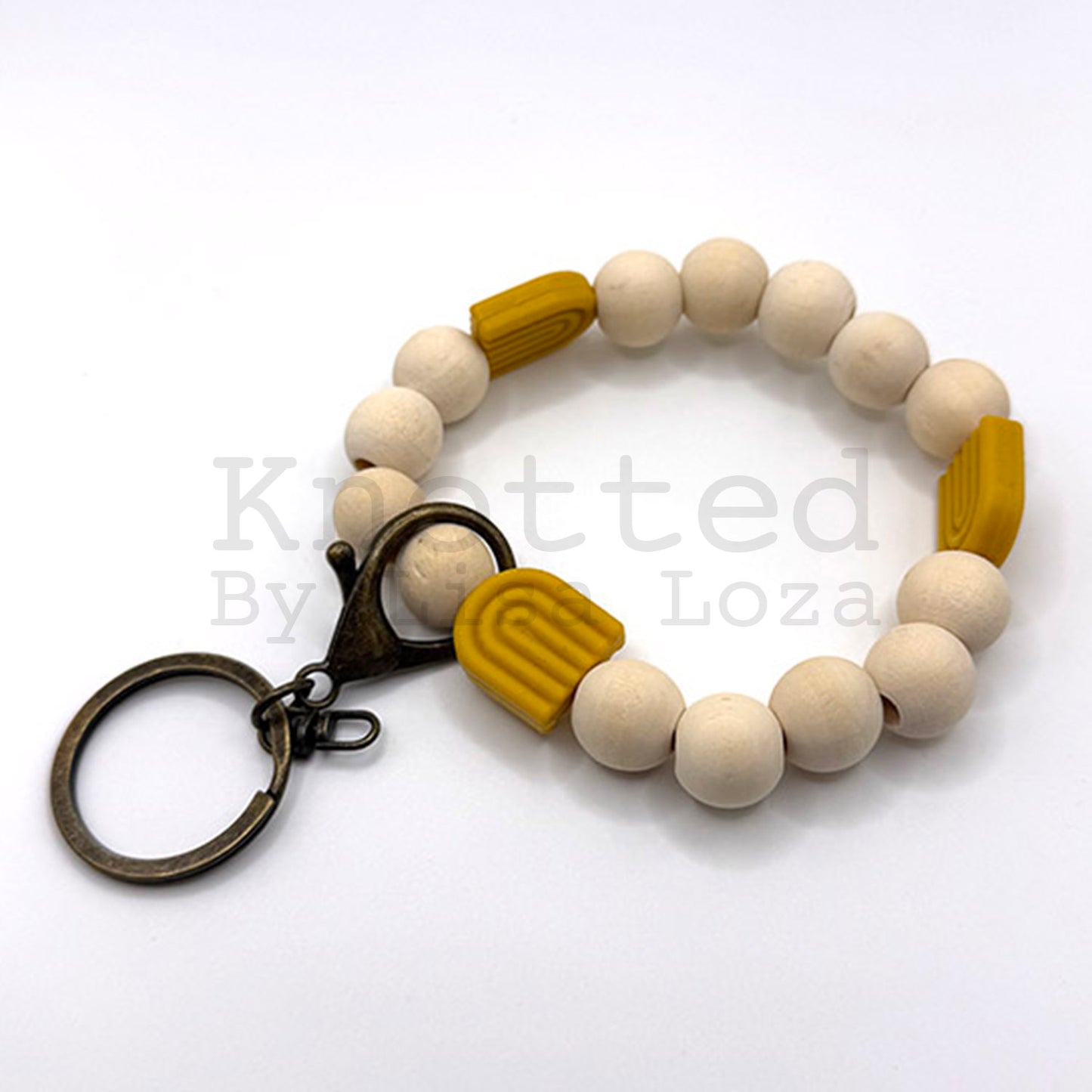 Gold wood bead keychain bracelet with silicone rainbow by Knotted by Lisa Loza