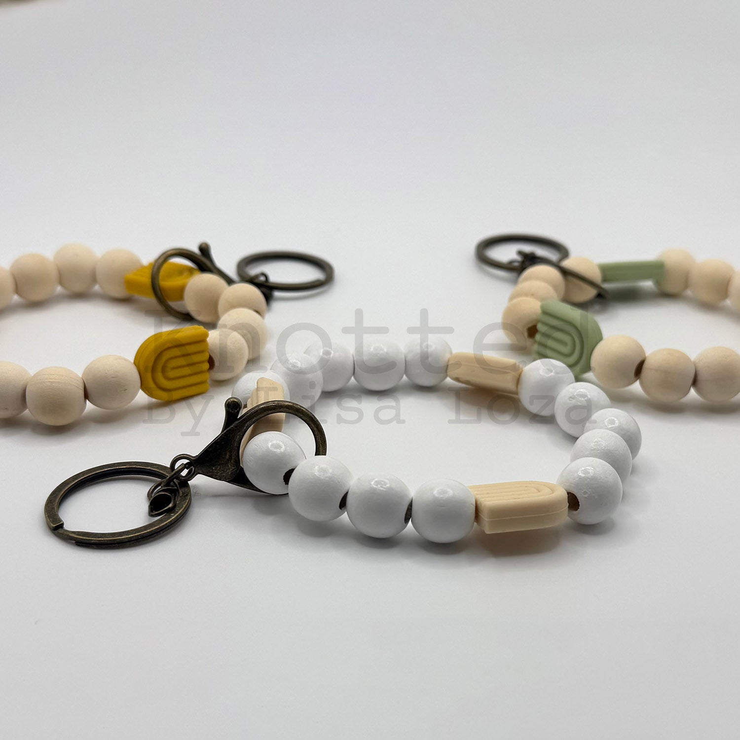 Wood bead keychain bracelet with silicone rainbows by Knotted by Lisa Loza