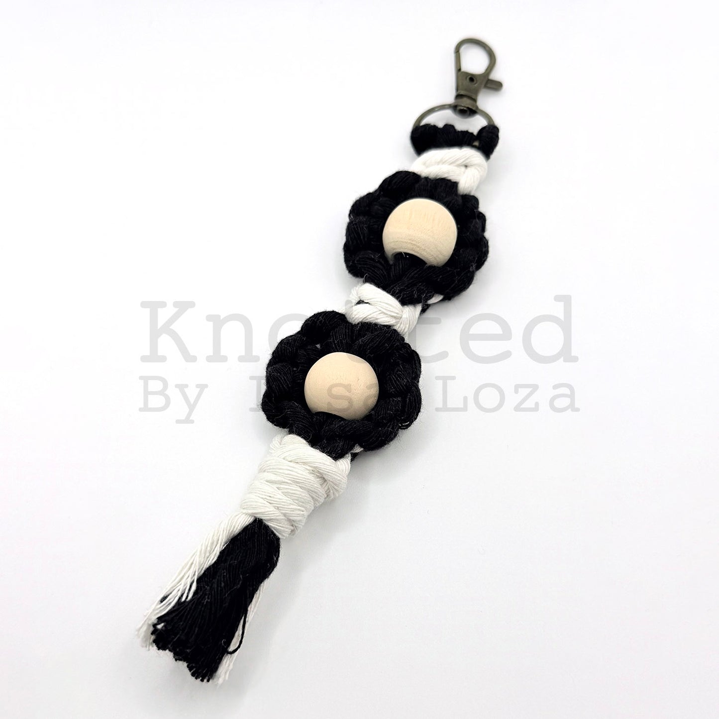 Black macramé flower keychain by Knotted by Lisa Loza